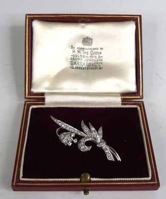 Lot 2760 - A white metal diamond brooch in the form of a...