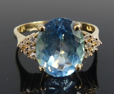 Lot 2764 - A yellow metal blue topaz and diamond set...