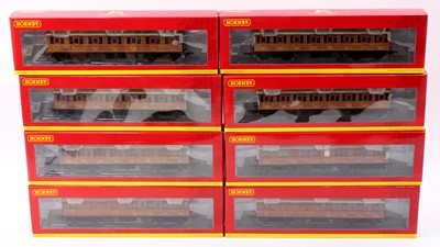 Lot 605 - A rake of eight Hornby varnished teak coaches:...