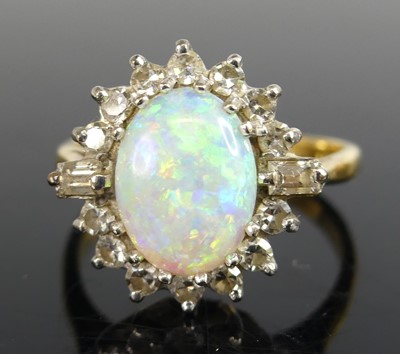 Lot 2767 - A yellow and white metal opal and diamond oval...