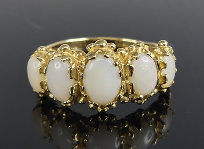 Lot 2775 - A 9ct yellow gold five stone opal dress ring,...