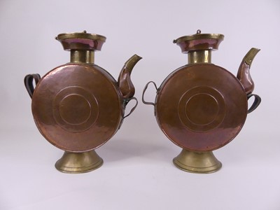 Lot 30 - A pair of Eastern copper drum-shaped canisters,...