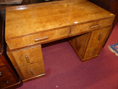 Lot 1184 - An Art Deco figured walnut twin pedestal...