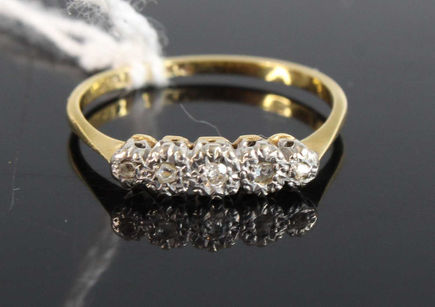 Lot 365 - An 18ct gold platinum and diamond five stone...