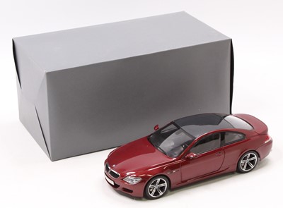 Lot 908 - A Kyosho 1/18th scale BMW M6 in burgundy as...