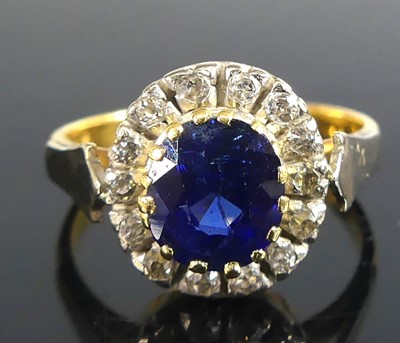 Lot 2623 - A 22ct yellow gold, sapphire and diamond oval...