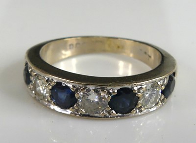 Lot 2648 - An 18ct white gold, sapphire and diamond half...