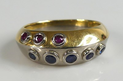 Lot 2594 - An 18ct yellow and white gold, sapphire and...