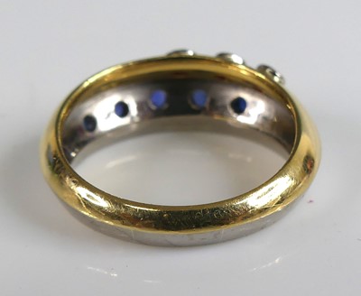 Lot 2594 - An 18ct yellow and white gold, sapphire and...