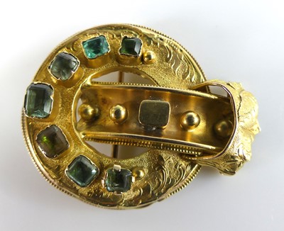 Lot 2617 - A yellow metal buckle brooch, with engraved...