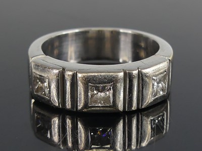 Lot 2620 - A white metal diamond three-stone ring,...