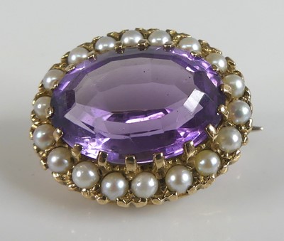 Lot 2582 - A 9ct yellow gold, amethyst and pearl oval...