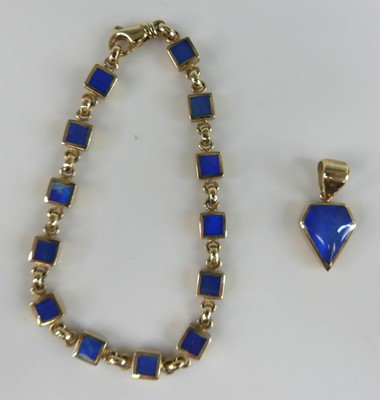 Lot 2651 - A contemporary 9ct yellow gold and blue enamel...