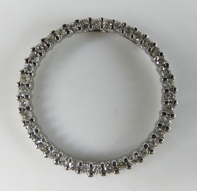 Lot 2686 - A contemporary white metal and diamond set...