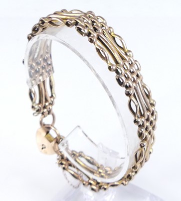 Lot 2798 - A 9ct gold gatelink bracelet having heart...