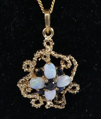 Lot 2800 - A contemporary 9ct gold opal and sapphire set...