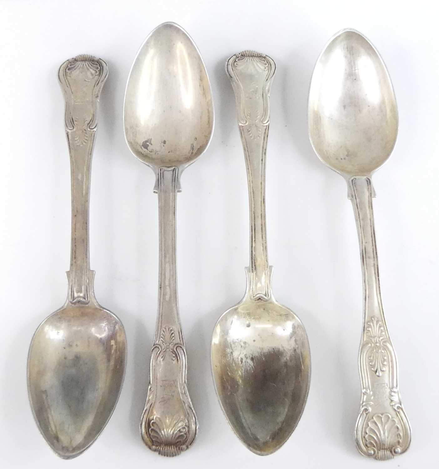 Lot 2080 - Three Irish silver dessert spoons, in the...