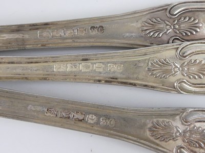 Lot 2080 - Three Irish silver dessert spoons, in the...