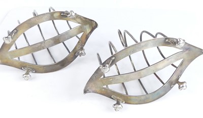 Lot 2096 - A pair of late Victorian silver toast racks,...