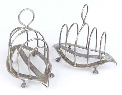 Lot 2096 - A pair of late Victorian silver toast racks,...