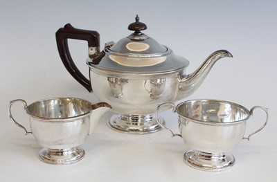 Lot 2131 - A George V silver three-piece tea set,...