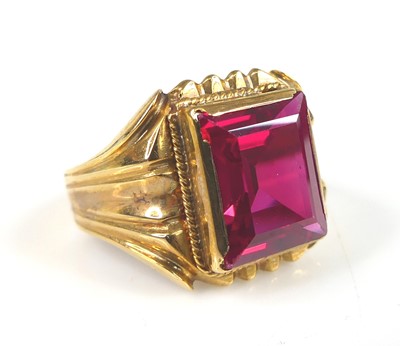 Lot 2710 - A yellow metal synthetic ruby dress ring, the...