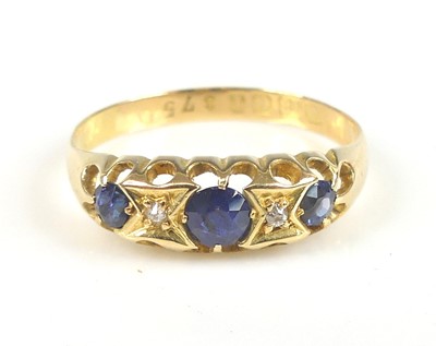 Lot 2711 - An 18ct yellow gold, sapphire and diamond half...