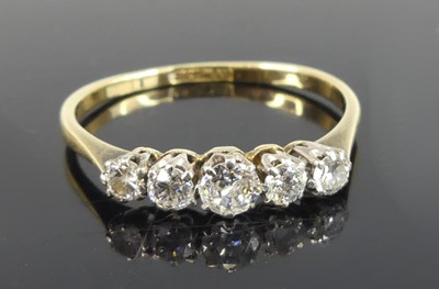 Lot 2712 - A yellow and white metal diamond half hoop...