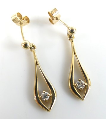 Lot 2722 - A pair of yellow metal diamond drop earrings,...