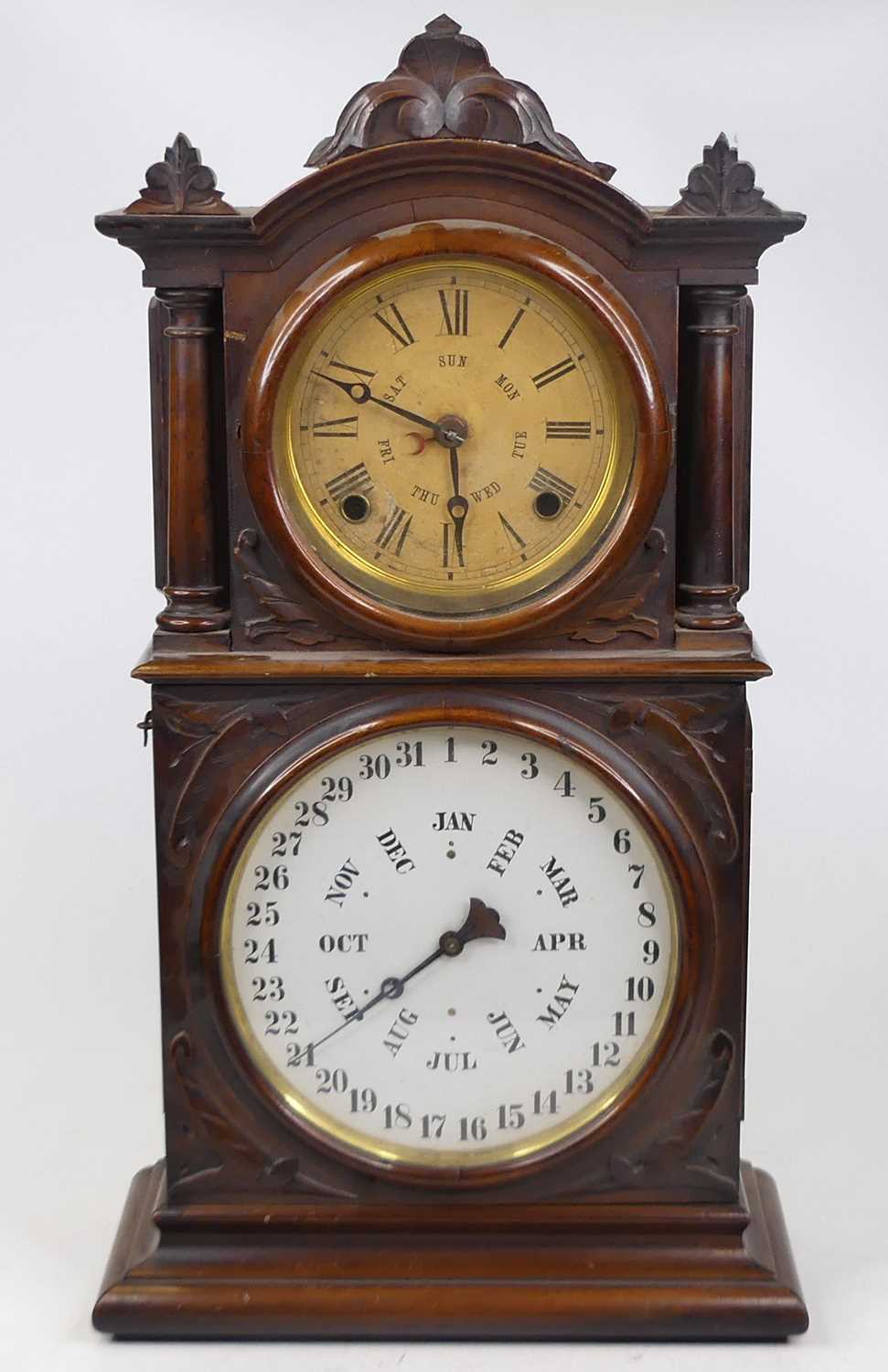 Lot 34 - An E. Ingraham & Co. walnut cased twin dial...