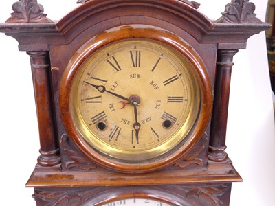 Lot 34 - An E. Ingraham & Co. walnut cased twin dial...