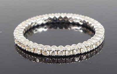 Lot 2780 - A white metal diamond eternity ring,...