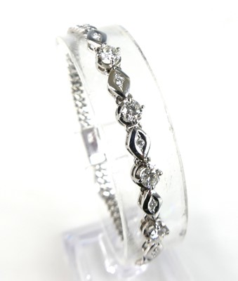 Lot 2781 - A white metal diamond bracelet, featuring four...