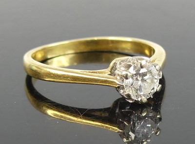 Lot 2804 - An 18ct gold diamond solitaire ring, the...