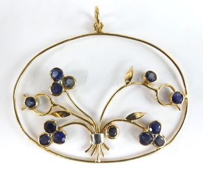 Lot 2817 - A contemporary yellow metal and sapphire set...