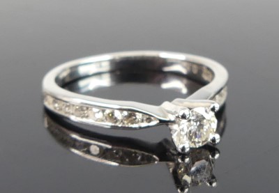 Lot 2824 - A contemporary platinum diamond ring, arranged...