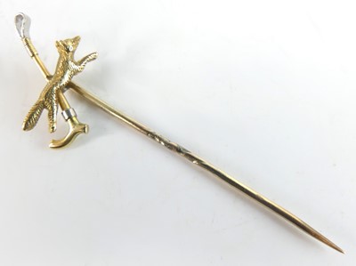 Lot 454 - A yellow metal tie-pin formed as a fox and...