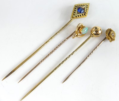 Lot 2827 - A yellow metal blue paste set tie-pin, the...