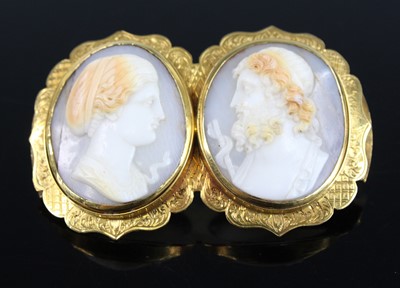 Lot 2868 - A Victorian carved shell cameo double brooch...