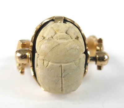 Lot 2846 - An Egyptian yellow metal scarab beetle ring,...