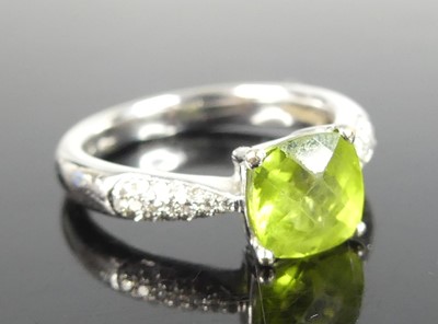 Lot 2847 - A contemporary 18ct white gold peridot and...