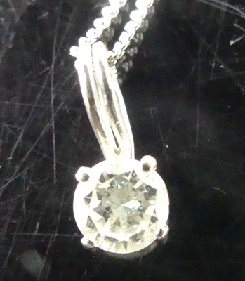 Lot 2852 - A diamond pendant, the four claw set brilliant...