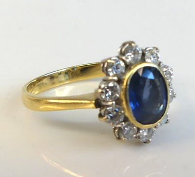 Lot 2214 - An 18ct yellow and white gold sapphire and...