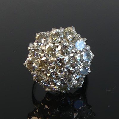 Lot 2230 - An 18ct white gold diamond circular cluster...