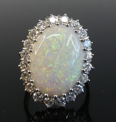 Lot 2225 - An 18ct yellow and white gold opal and diamond...