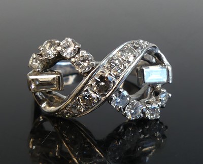 Lot 1293 - A white metal diamond crossover ring...