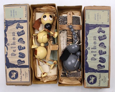 Lot 1557 - 2 boxed vintage Pelham Puppets, with one being...