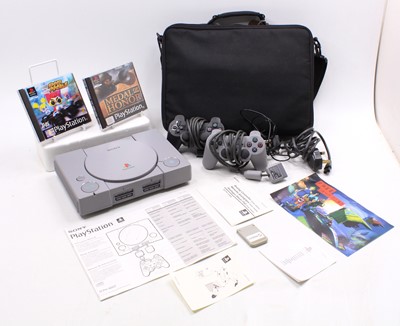 Lot 1622 - A Sony Playstation One housed in a soft case...