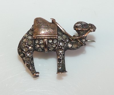 Lot 2185 - A yellow and white metal diamond camel brooch...