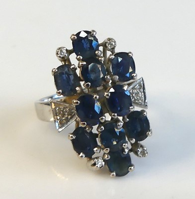 Lot 2168 - A white metal sapphire and diamond abstract...